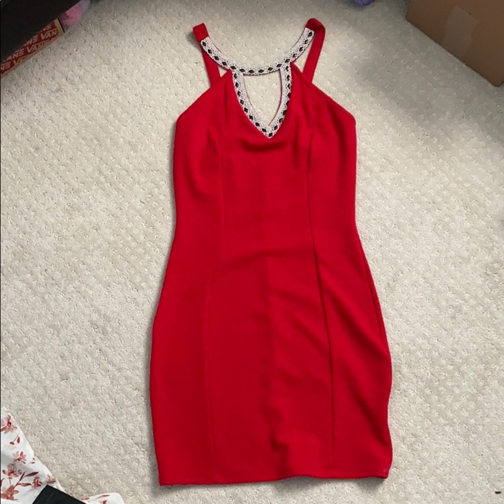 Red tight dress with embellishments on neck